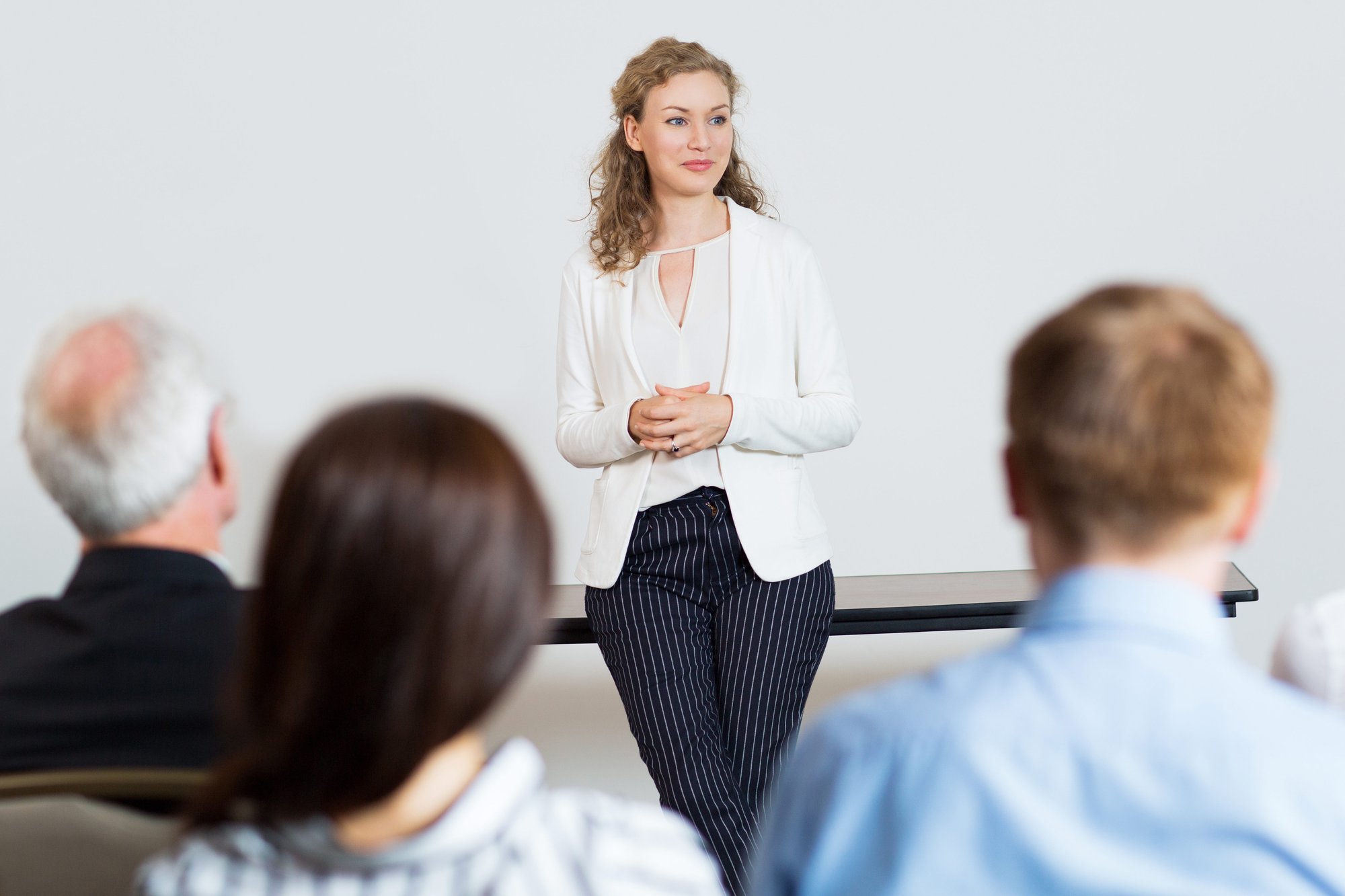 woman-giving-lecture-audience